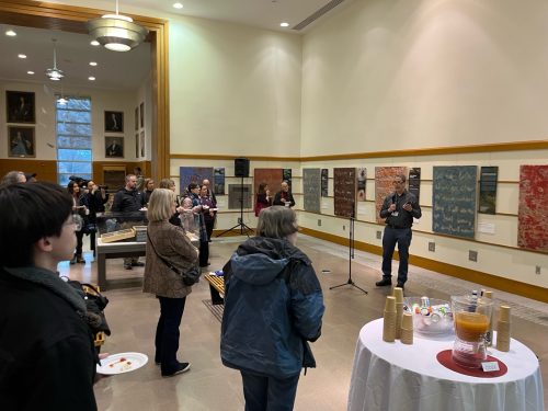 A person standing in front of a group of people AI-generated content may be incorrect.