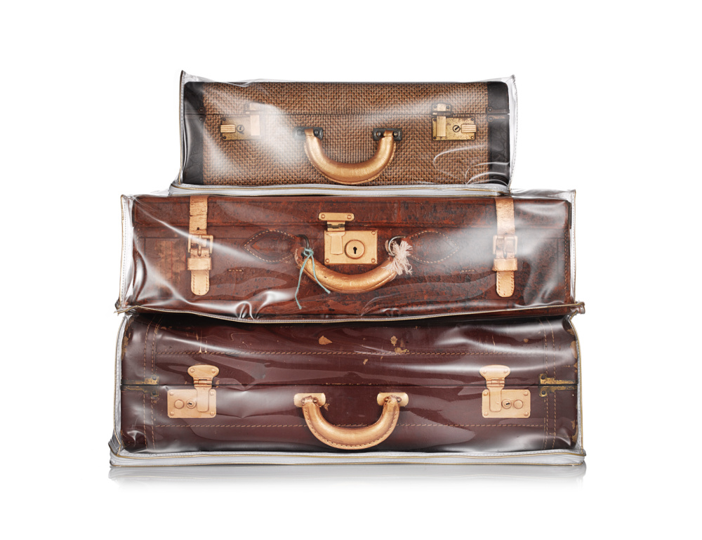 A stack of luggage in a plastic bag

AI-generated content may be incorrect.