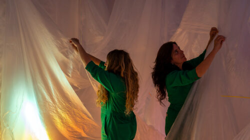 Denise Treizman and Julia Zurilla installing the exhibition