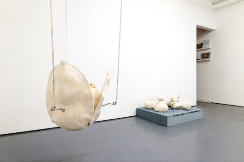 Left: Alison Kudlow, Ēostee (Risen), 2026, Ceramic, glass, cast aluminum, chain, 28 x 28 x 28 inches, hung 1 foot from the floor. Right: Se Young Yim, Pebble, 2026, Silicone, Plaster, Hanji (Korean traditional paper), motor, wires, acrylic paint, 37.5 x 31.5 x 6 inches.Photography by Carl Gunhouse.