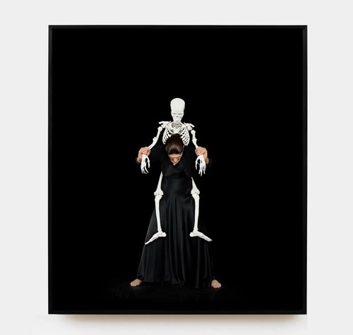 Marina Abramovic, Standing with Skeleton ed. 4, 2008/2016, Color chromogenic print, 80” x 71”, photo courtesy of Marc Straus Gallery